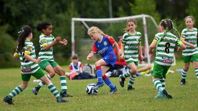 Linfield's Katie Lyness is outnumbered by Top Of The Hill Celtic players during their girls under-9's match at Wilton Park.