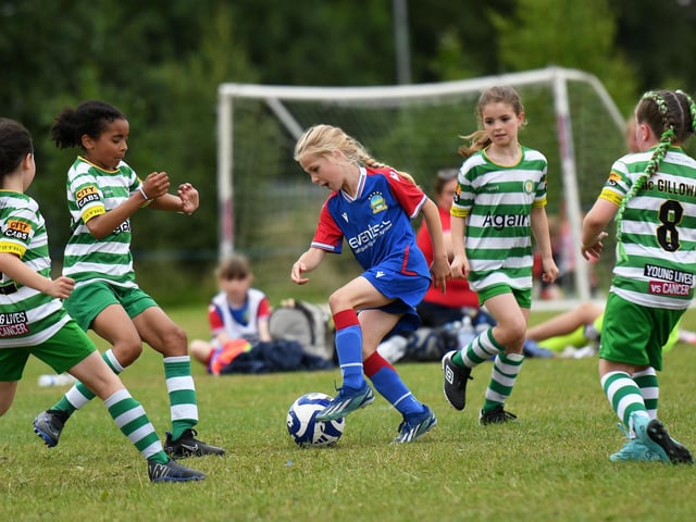 Linfield's Katie Lyness is outnumbered by Top Of The Hill Celtic players during their girls under-9's match at Wilton Park.