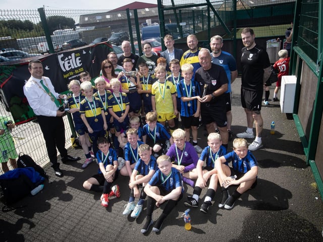 PADRAIG BARTON CUP WINNERS. . . .The Mayor of Derry City and Strabane District Council, Ruairi McHugh and members of the late Padraig Barton's family who were on hand to present trophies to the winners of this year's Feile '25 tournament to Don Bosco's. at front are beaten finalists Oxford United and included are match officials, organisers and local councillors and MLAs. (Photos: Jim McCafferty Photography)