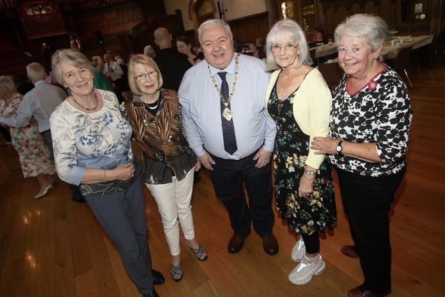 Deputy Mayor Darren Guy pictured with a group of ladies enjoying the Mayor's Tea Dance on Wednesday.