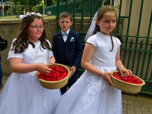Children from schools in the Long Tower parish, who made their First Holy Communion recently, take part in the Solemnity of Corpus Christi procession, in the ground of the church, on Sunday afternoon. Photo: George Sweeney. DER2324GS –