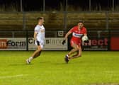 Tyrone’s Neil Devlin closes in on Derry’s Ben McCarron during the Dr McKenna Cup game at Owenbeg on Wednesday evening last.  Photo: George Sweeney. DER2302GS – 07
