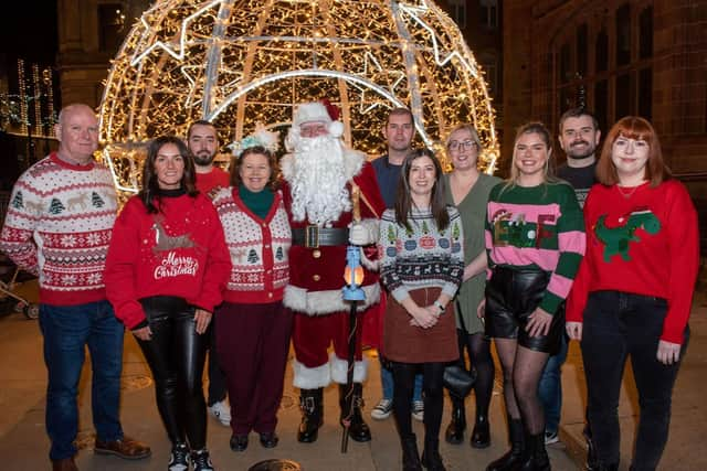 Mayor Patricia Logue, Santa and some of the spectators from Friday's Christmas light procession