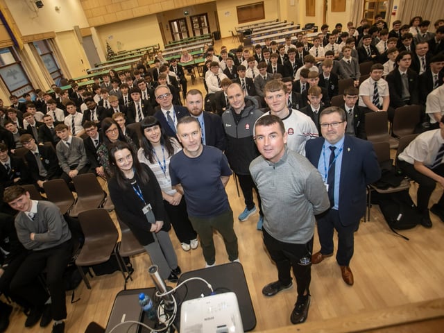 Oisin McConville, former Armagh GAA pictured with staff and students at St. Columb's College last week. (Jim McCafferty Photography)