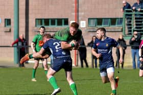 City of Derry’s Stephen Corr is intercepted during the Junior Cup against Ballynahinch on Saturday afternoon. Photo: George Sweeney. DER2312GS – 55