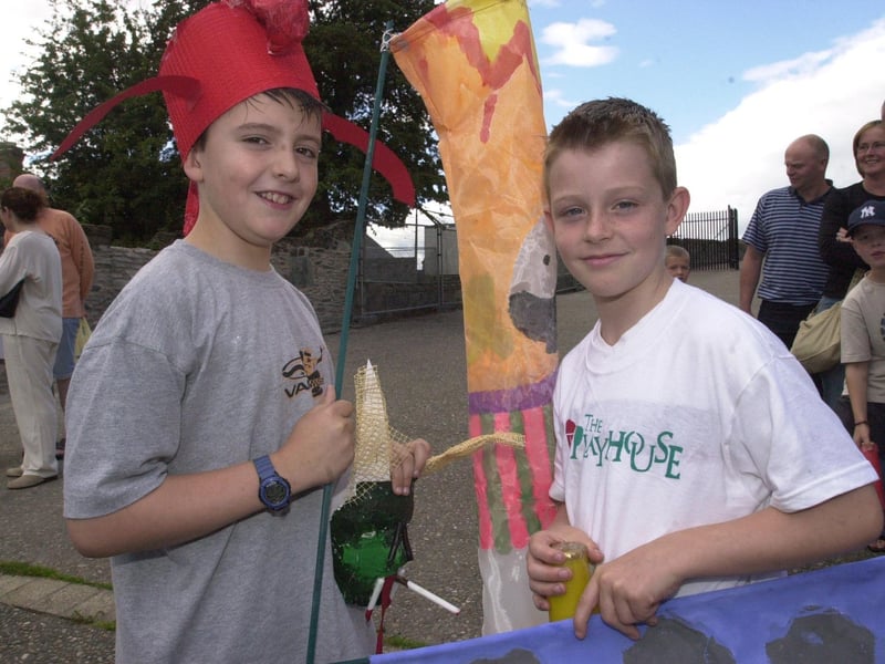 Ciaran Downey, left, and Mark Brenna take part in the fun of the festivities during the Playhouse Childrens Art Festival. (2907PG11)                               :Derry youngsters enjoying summer in August 2003