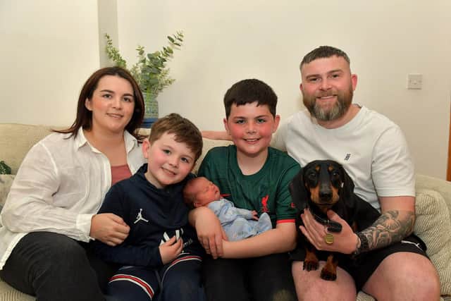 Toireasa and Barry McGavigan with their children Enan, holding baby Cobhlaith, Cáel, and their dog Hiro. Photo: George Sweeney.  DER2319GS – 37