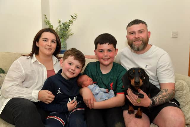 Toireasa and Barry McGavigan with their children Enan, holding baby Cobhlaith, Cáel, and their dog Hiro. Photo: George Sweeney. DER2319GS – 37