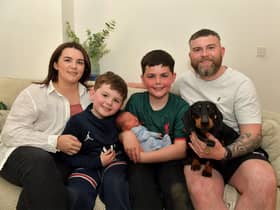 Toireasa and Barry McGavigan with their children Enan, holding baby Cobhlaith, Cáel, and their dog Hiro. Photo: George Sweeney.  DER2319GS – 37