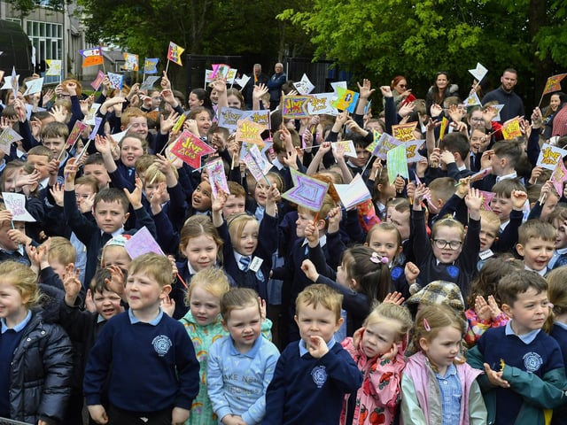 Happy pupils from Rosemount Primary School enjoy the entertainment from the Jive Aces on Thursday morning. Photo: George Sweeney