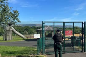 Police investigating a fire in a play park.