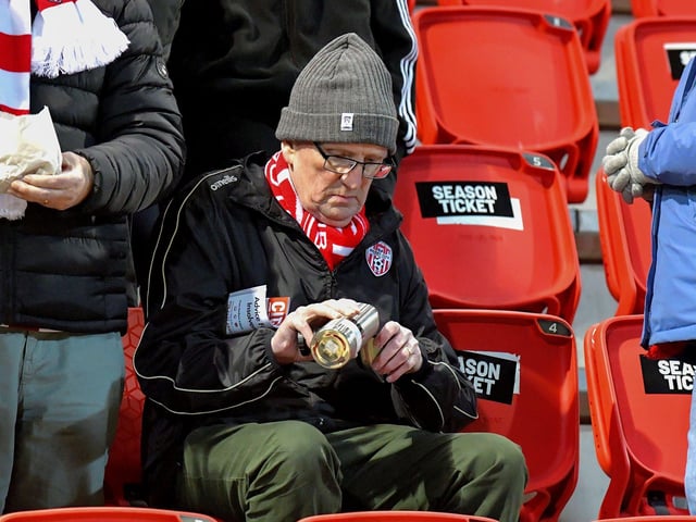 A Derry City fan pours himself a cuppa before Derry City’s game against Cork City on Friday evening. Photo: George Sweeney. DER2308GS – 139