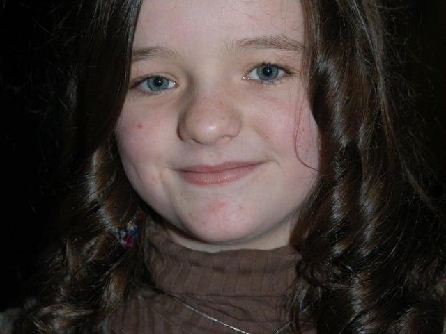 Anna celebrating her birthday with family and friends at the bowling alley.
