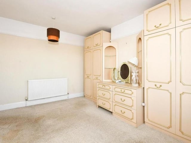 Here is the main bedroom, which is a really good size and, as you can see, boasts plenty of space for wardrobes and a dressing table.