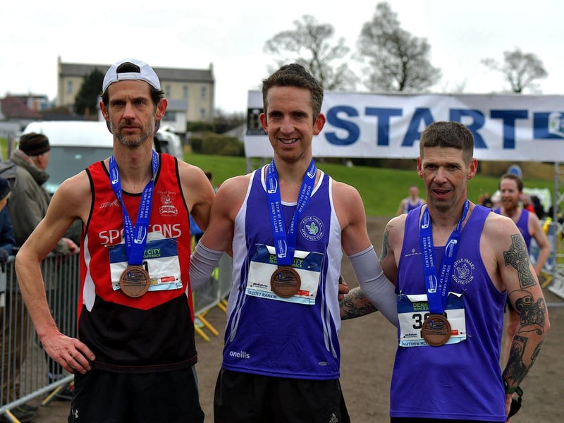 March 2023: Allan Bogle, City of Derry Spartans, second place, Scott Rankin, Foyle Valley, winner, and Matthew McLaughlin, Foyle Valley, took third place in the Bentley Group Derry 10 Miler road race. Photo: George Sweeney