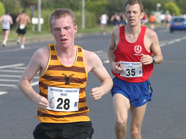 Douglas Finley (28), keeping ahead of Mario Hayes (35). (1609T53).:.
