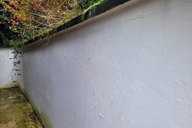 A retaining wall in North Meadows where sewage which helped stop further damage being caused to homes in Derry.