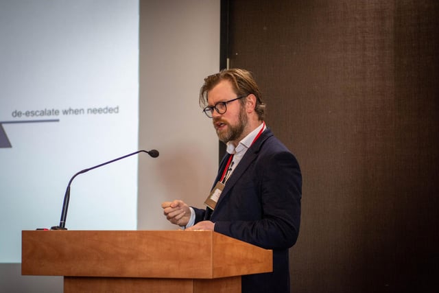 Dr Conor O'Neill, Consultant Oncologist at the North West Cancer Centre presenting on recent advancements in breast cancer research at the Hive Cancer Support World Cancer Day Conference.