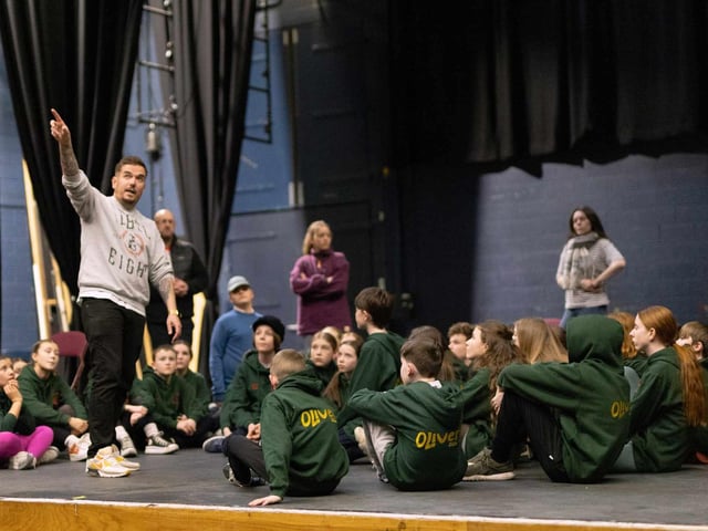 Director Michael Poole with the children's chorus in LMS' production of Oliver! which runs in the Millennium Forum from March 20-23.