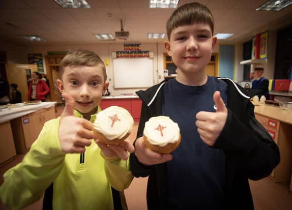 CUPCAKES R US!. . . .P7 pupils Sean Millar (St. Therese's PS) and Patrick Breslin (Oakgrove PS) enjoy some cupcakes at the St. Joseph''s Boys School Open Night.