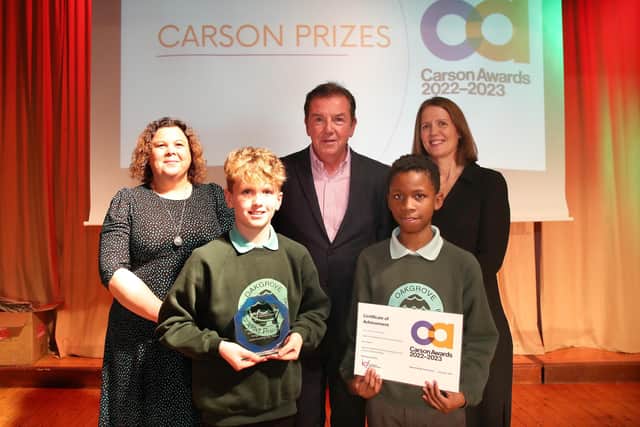 Oakgrove IPSN pupils and teachers receiving their Carson Award from co-founder Tony Carson.. Photograph by Declan Roughan.
