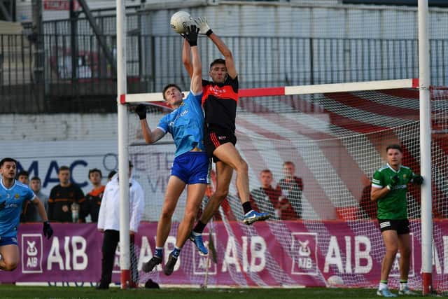 Ruairi Forbes of Ballinderry and Carrickcruppen’s Eoin Woods contest a high ball. Photo: George Sweeney
