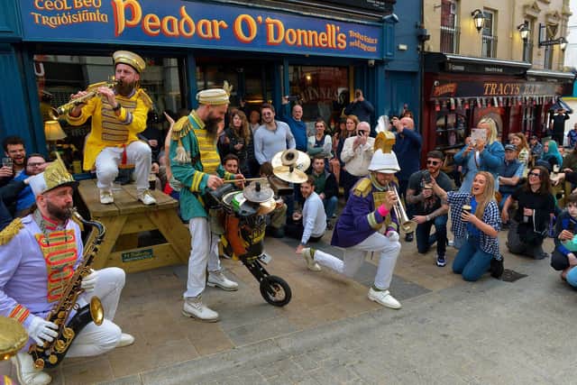 Mr Wilson’s Second Liners playing outside Peadar O'Donnell's pub on Waterloo Street over a previous Jazz Festival weekend. Photo: George Sweeney.  DER2217GS – 080