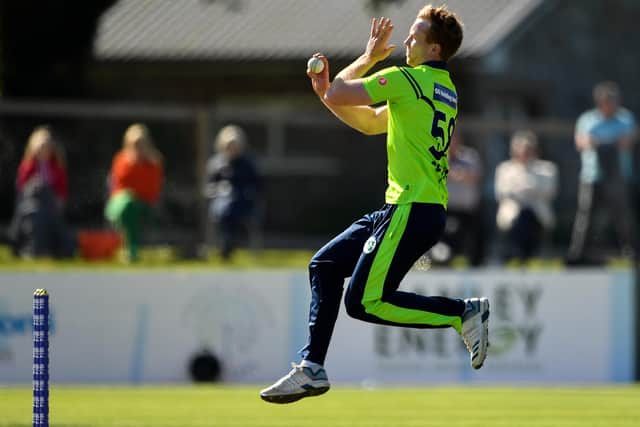 Shane Getkate of Ireland bowls a delivery during the T20 International Tri Series match between Ireland and Scotland at Malahide Cricket Club in Dublin