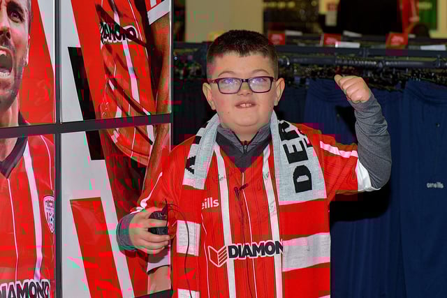 Derry City fan Darragh Hutton records a good luck video message for the Candystripes, at O’Neill’s Sports store, ahead of their Extra.ie FAI Cup final against Shelbourne. DER2244GS – 101