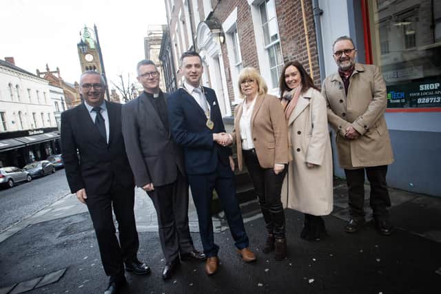 INNER CITY TRUST GETS SHARE OF £5M. . . . . .The Deputy Mayor of Derry City and Strabane District Council, Jason Barr congratulating Helen Quigley, Inner City Trust on the Trust receiving a share of £5m funding for heritage restoration. The monies will help to breathe new life into the disused and at-risk historic buildings throughout the city. Included from left are Tony Monaghan, Regeneration Manager, DCSDC, Rev. Robert Millar, Chair, ICT, Karen Philips, Director of Environment and Regeneration at DCSDC and John Meehan. Inner City Trust.