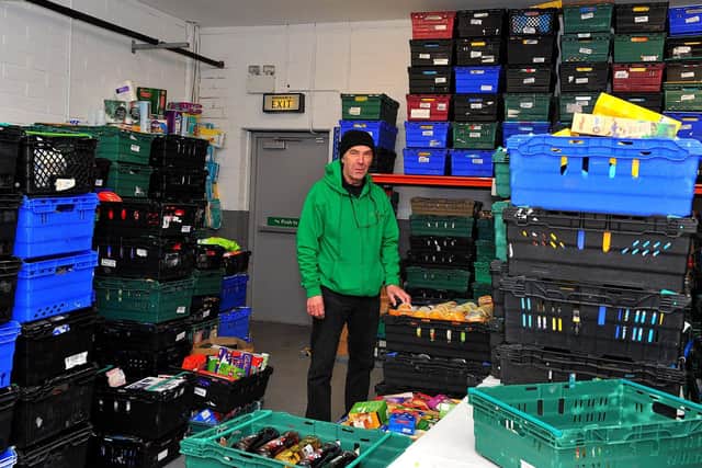 Paul Duffy works in the Foyle Foodbank distribution centre in Springtown Industrial Estate. Photo: George Sweeney. DER2250GS – 26
