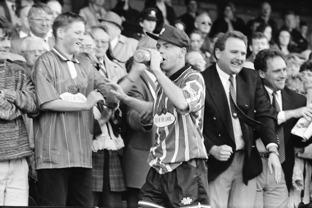 Stuart Gauld makes his way up the stand after the game.