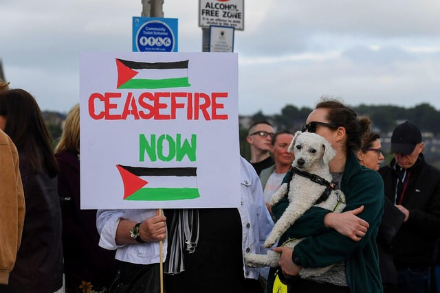 People gather for a Vigil for Gaza held on the Peace Bridge on Friday Evening, organised by the Derry Irish Palestinian Solidarity Campaign. Photo: George Sweeney