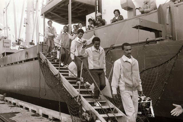 In June 1985, 40 years ago, six men who had stowed away on a boat to escape the famine in Ethiopia arrived in Derry. They were refused asylum elsewhere but were granted permission to stay in Derry and were welcomed with open arms by the city after being led off the boat by John Hume himself. Their story made headlines around the world.