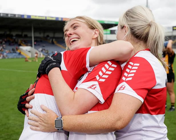 Derry's Lauren McKenna, Rachel Downey and goalkeeper Laura Coyle celebrate at the final whistle of the 2023 Glen Dimplex All-Ireland Intermediate Camogie Championship in FBD Semple Stadium, Tipperary. (©INPHO/Laszlo Geczo)