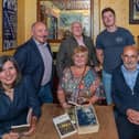Discussing Steinbeck at Frank Owens Bar, Limavady: Back Row: Harry Coates, Dougie Bartlett, Terence Owens. Front Row: Sharon Colhoun (RVACC), Rita Deans and Paul Campbell. Photo: Nigel McFarland.