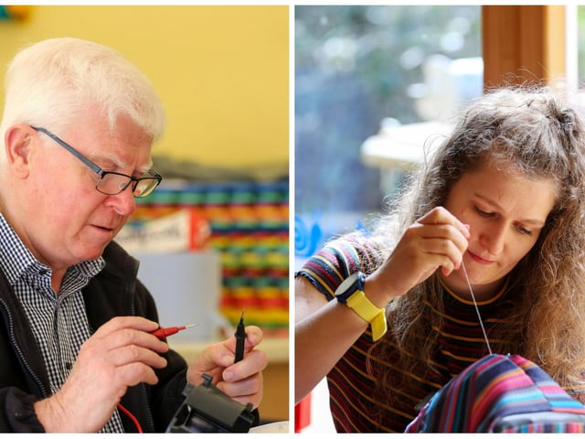 Volunteer Stewart Wright fixes electrical items and volunteer Elisia Gormley at the textile repair station.