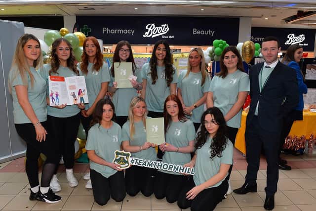 Teacher Mr Quigley and Thornhill Year 13 students pictured at their ‘To My Younger Self’ self-esteem stall during the Young Enterprise trade fair held in the Foyleside Shopping Centre on Friday. Photo: George Sweeney. DER2307GS – 58