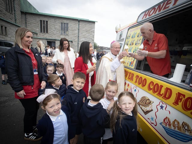 Bishop Donal McKeown helping hand out the ice cream after Thursday's May Procession at Holy Child Primary School.