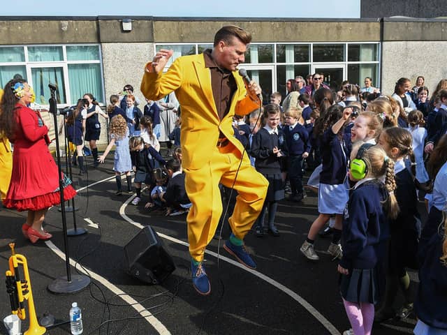 Ian Clarkson of the Jive Aces performing at Rosemount Primary School on Thursday morning. Photo: George Sweeney