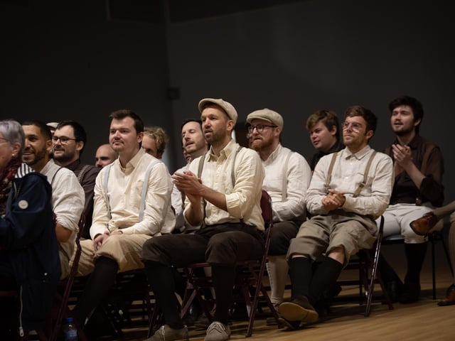 Members of the Swiss Choir Männerstimmen Basel enjoying the Mellow DEEDS Choir performance on Thursday.