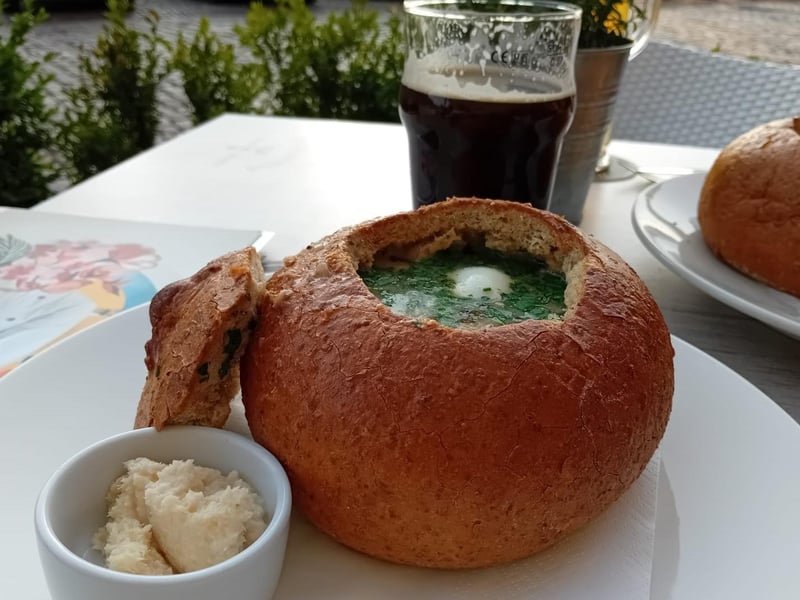 A traditional żurek, a sour rye soup with sausage, egg and mushrooms served in a bread loaf, at Brovarnia Gdánsk.