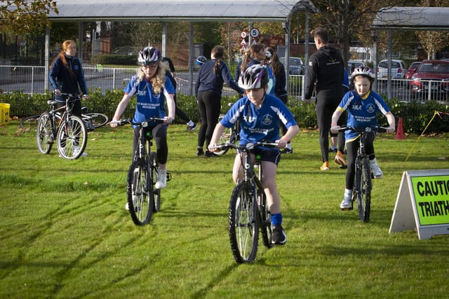 Cyclists start the second part of their duathlon on Wednesday at St. Mary’s College.