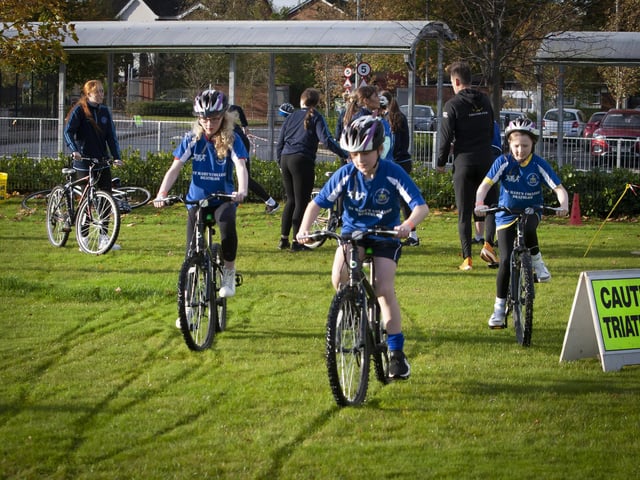 Cyclists start the second part of their duathlon on Wednesday at St. Mary’s College.