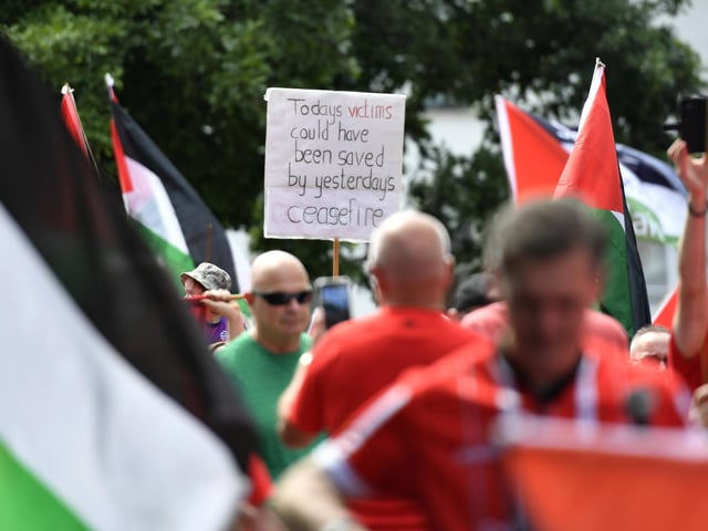 The ‘Turn Shipquay Street Red for Gaza’ march makes its way along Bishop Street  towards Shipquay Street on Saturday afternoon. Photo: George Sweeney