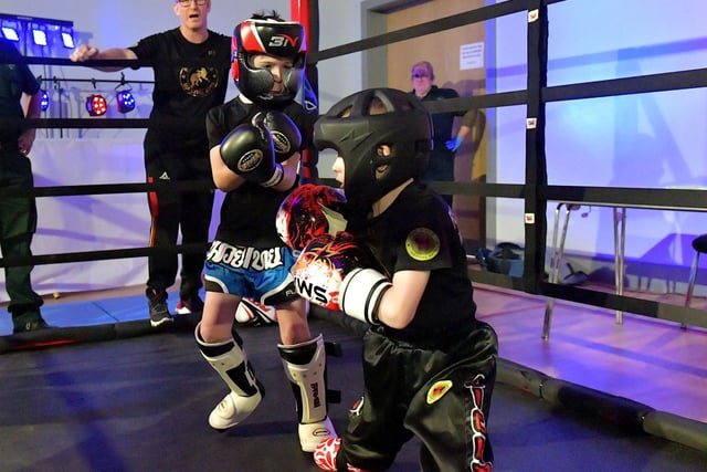 Cian Sharkey (on the left), from Strike Martial Arts, takes on Cabel McCann from Full Circle Martial Arts in The Rising Stars event held in Shantallow Community Centre on Saturday. Photo: George Sweeney. DER2308GS – 146