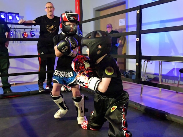 Cian Sharkey (on the left), from Strike Martial Arts, takes on Cabel McCann from Full Circle Martial Arts in The Rising Stars event held in Shantallow Community Centre on Saturday. Photo: George Sweeney. DER2308GS – 146