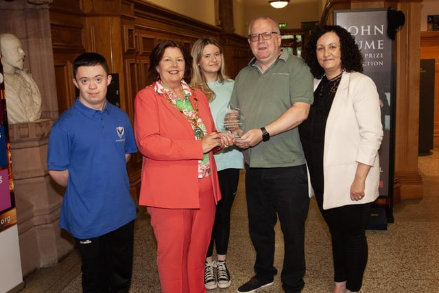 The Mayor, Patricia Logue making a presentation to Kevin Morrison at the Guildhall on Wednesday evening in recognition of his services to the Oxford Bulls. Included are Kevin's wife Joe, daughter Anna and son Adam.