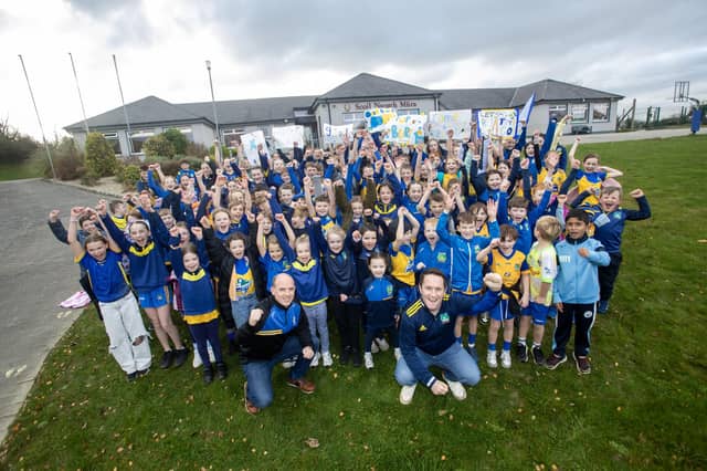 Pupils and staff from Scoil Naomh Mura, Burnfoot showing their support for the Beart GAC hurlers who will take on Lavey in the Ulster Junior Championship final at Celtic Park on Saturday. (Photos: Jim McCafferty Photography)
