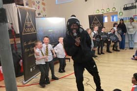 Black Paddy during a visit to the Model Primary School.
